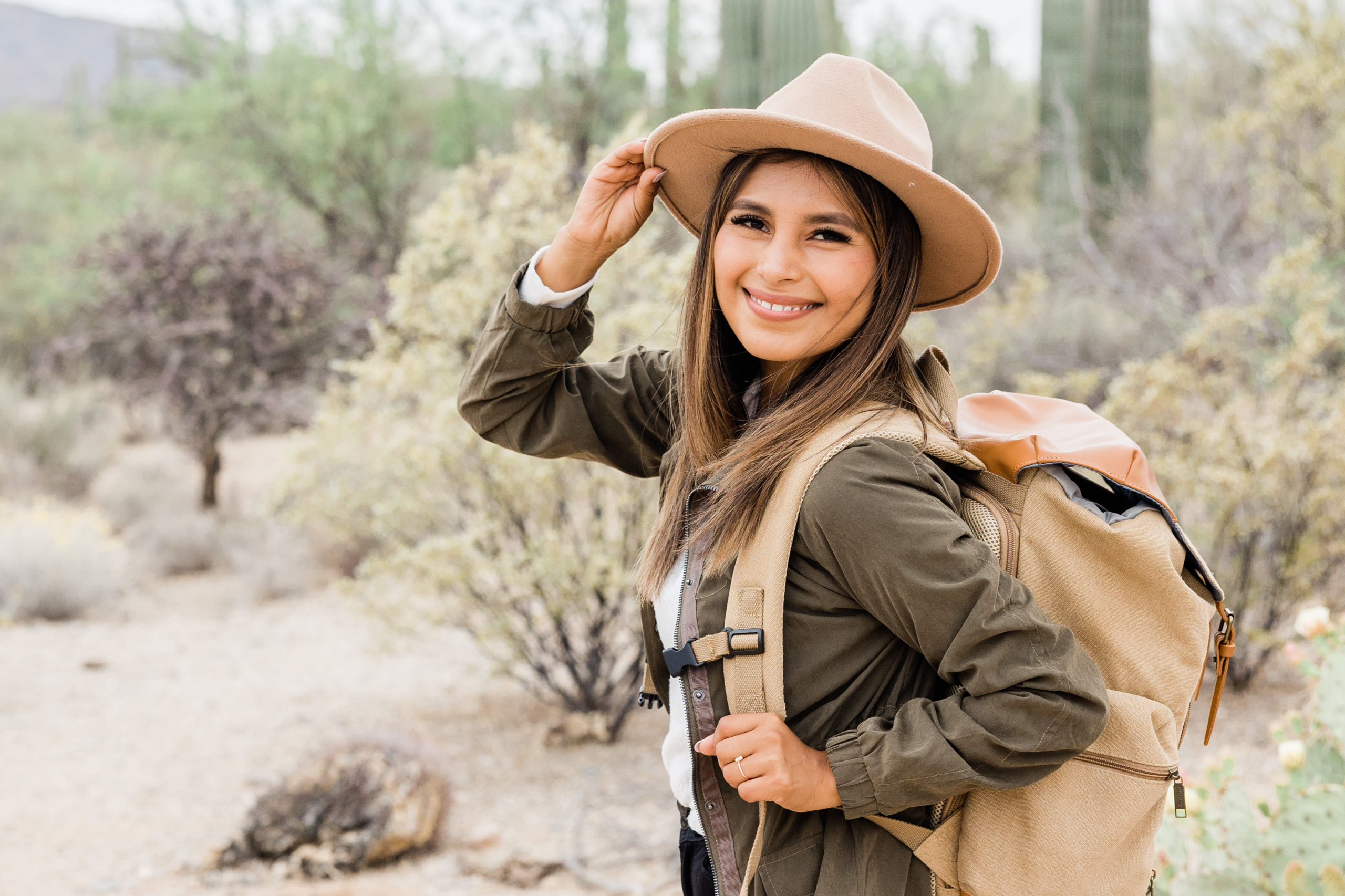 Women hiking with a wide brimmed hat