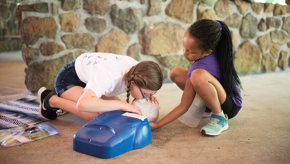 SheJumps, 501(c)(3) nonprofit organization helping girls get into the outdoors - girls learning CPR